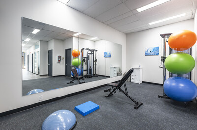 Therapy equipment including weight bench and exercise ball at Audax Sport Medicine, Calgary, used in recovery sessions
